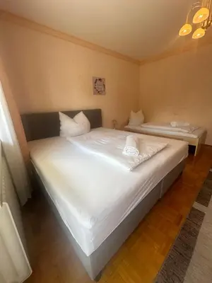 Ein Bett oder Betten in einem Zimmer der Unterkunft Tabita 1 Apartment with 3 rooms if needed 4 or 5 rooms