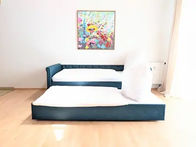Ein Bett oder Betten in einem Zimmer der Unterkunft Galeriewohnung bei Wasserburg am Inn