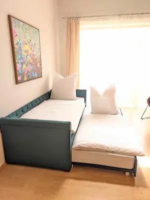 Ein Bett oder Betten in einem Zimmer der Unterkunft Galeriewohnung bei Wasserburg am Inn