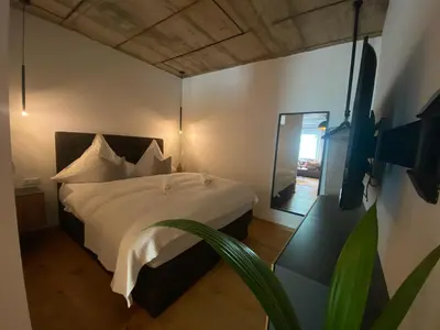 Ein Bett oder Betten in einem Zimmer der Unterkunft JetaHome