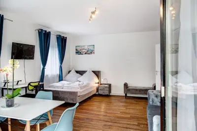 Ein Bett oder Betten in einem Zimmer der Unterkunft Alpina Apartment