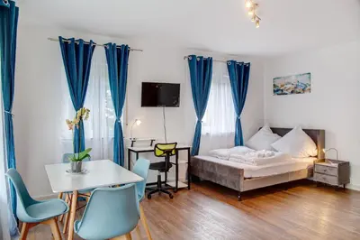 Ein Bett oder Betten in einem Zimmer der Unterkunft Alpina Apartment