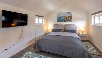 Ein Bett oder Betten in einem Zimmer der Unterkunft SweetHome - Maisonette Apartment, Parkplatz, WiFi, nähe Zentrum