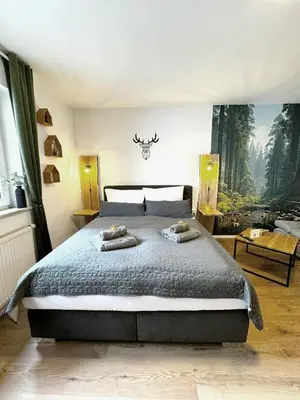 Ein Bett oder Betten in einem Zimmer der Unterkunft Familienoase nahe Innenstadt