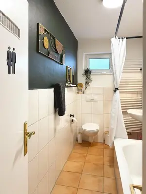 Ein Badezimmer in der Unterkunft Familienoase nahe Innenstadt