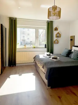 Ein Bett oder Betten in einem Zimmer der Unterkunft Familienoase nahe Innenstadt