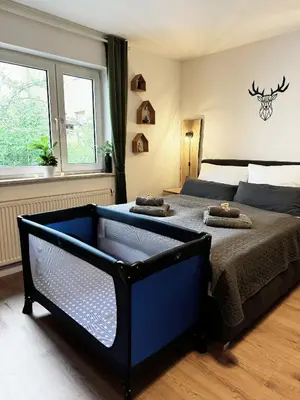 Ein Bett oder Betten in einem Zimmer der Unterkunft Familienoase nahe Innenstadt