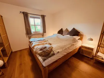Ein Bett oder Betten in einem Zimmer der Unterkunft Achentalglück