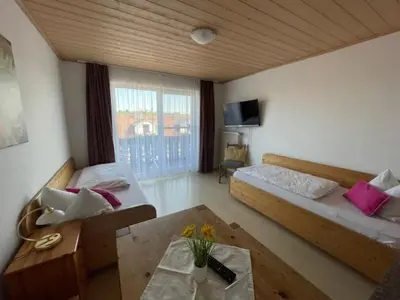 Ein Bett oder Betten in einem Zimmer der Unterkunft Pension Mariandl Appartement 1