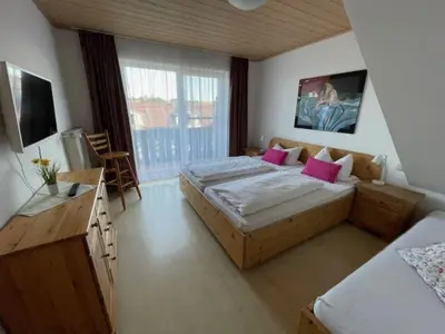 Ein Bett oder Betten in einem Zimmer der Unterkunft Pension Mariandl Appartement 1