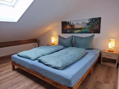 Ein Bett oder Betten in einem Zimmer der Unterkunft Ferienwohnung Okami-Familie Bernöcker