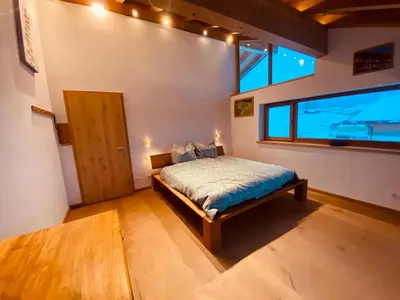 Ein Bett oder Betten in einem Zimmer der Unterkunft Traumhaus sensationeller Lage Traumhafter Bergblick absolute Ruhe