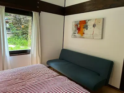 Ein Bett oder Betten in einem Zimmer der Unterkunft Das Rote Haus am See