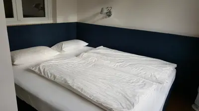 Ein Bett oder Betten in einem Zimmer der Unterkunft Offen gestaltetes Design Apartment in Bad Wiessee, 350m vom See