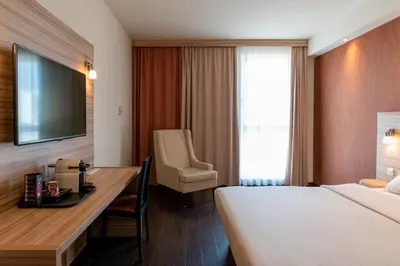 Ein Bett oder Betten in einem Zimmer der Unterkunft Star G Hotel Premium München Domagkstraße