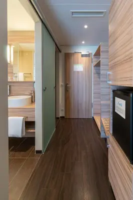 Ein Bett oder Betten in einem Zimmer der Unterkunft Star G Hotel Premium München Domagkstraße