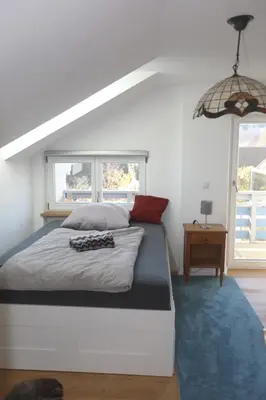 Ein Bett oder Betten in einem Zimmer der Unterkunft Tolle Ferienwohnung in Prien am Chiemsee