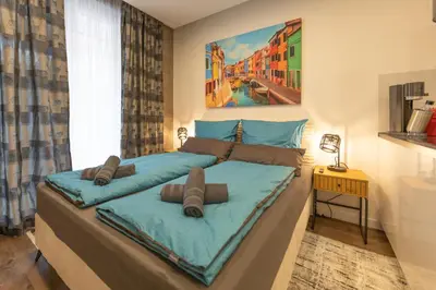 Ein Bett oder Betten in einem Zimmer der Unterkunft SweetHome - Küche, Wifi, Nähe Grünwalder Stadion