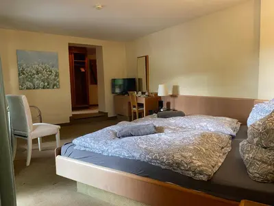 Ein Bett oder Betten in einem Zimmer der Unterkunft Gästehaus Altes Fährhaus
