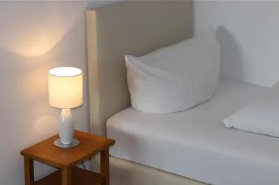 Ein Bett oder Betten in einem Zimmer der Unterkunft Pension Hubertusstuben