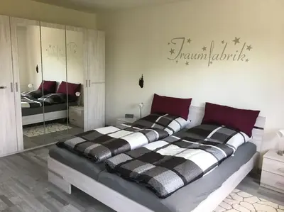 Ein Bett oder Betten in einem Zimmer der Unterkunft Ferienwohnung Filli mit Sauna und Pool im Haus