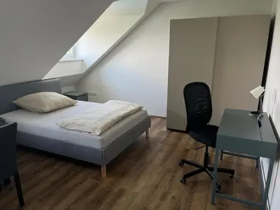 Ein Bett oder Betten in einem Zimmer der Unterkunft Binderhof