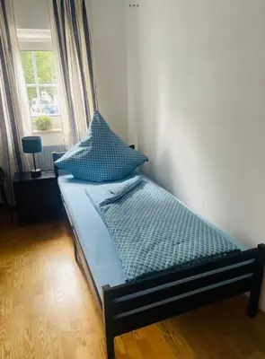 Ein Bett oder Betten in einem Zimmer der Unterkunft Altstadthaus an der Kleinen Donau