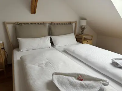 Ein Bett oder Betten in einem Zimmer der Unterkunft ღLIBORIA I Alpenblick Landhaus