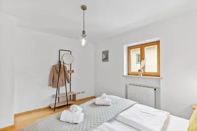 Ein Bett oder Betten in einem Zimmer der Unterkunft Casa Primavera - Stadtvilla mitten in Miesbach
