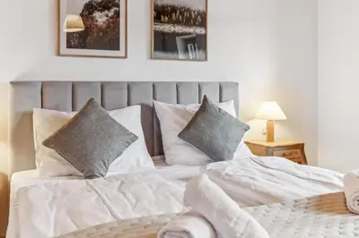 Ein Bett oder Betten in einem Zimmer der Unterkunft Casa Primavera - Stadtvilla mitten in Miesbach
