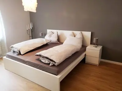 Ein Bett oder Betten in einem Zimmer der Unterkunft FeWo,zentral,ruhig und 30 Minuten nach München