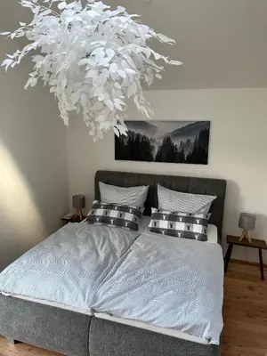 Ein Bett oder Betten in einem Zimmer der Unterkunft Boschenhof Suite