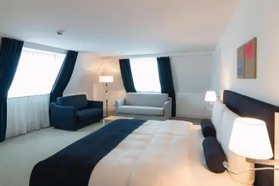 Ein Bett oder Betten in einem Zimmer der Unterkunft Bayer 89 Vi Vadi Hotel