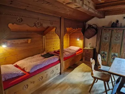 Ein Bett oder Betten in einem Zimmer der Unterkunft Perfektes Alpenrefugium mit Hüttencharacter