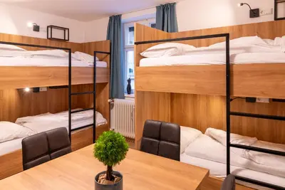 Ein Bett oder Betten in einem Zimmer der Unterkunft Brauhaus-Hostel König von Flandern