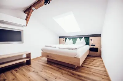 Ein Bett oder Betten in einem Zimmer der Unterkunft Moierhof - Der Ferienbauernhof am Chiemsee