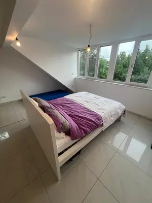 Ein Bett oder Betten in einem Zimmer der Unterkunft Zimmer im Haus nahe Ubahn