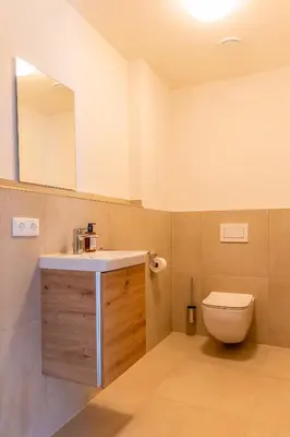 Ein Badezimmer in der Unterkunft Graf Chiemo Suites - direkt am Chiemsee mit separatem Seezugang