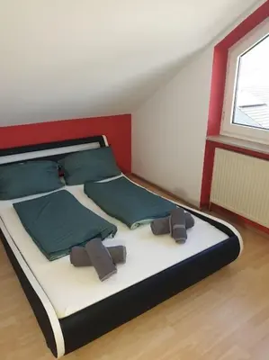 Ein Bett oder Betten in einem Zimmer der Unterkunft Schöne Wohnung zentral Ingolstadt