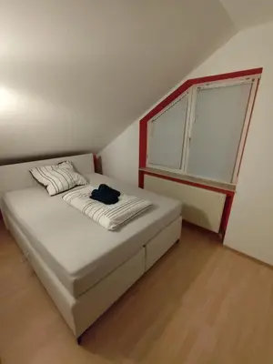 Ein Bett oder Betten in einem Zimmer der Unterkunft Schöne Wohnung zentral Ingolstadt