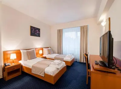 Ein Bett oder Betten in einem Zimmer der Unterkunft Pension De Lux Königsbrunn