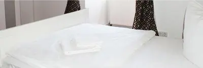 Ein Bett oder Betten in einem Zimmer der Unterkunft Pension De Lux Königsbrunn