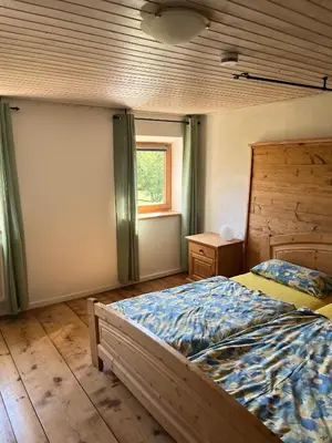 Ein Bett oder Betten in einem Zimmer der Unterkunft Ferienwohnung Metzner