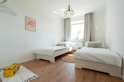 Ein Bett oder Betten in einem Zimmer der Unterkunft CASA Sunset Augsburg - unvergessliche Aussicht - 1min zu TRAM&Bus