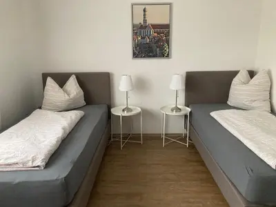 Ein Bett oder Betten in einem Zimmer der Unterkunft FeWo Anne