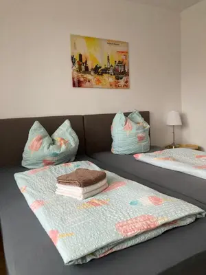 Ein Bett oder Betten in einem Zimmer der Unterkunft FeWo Anne