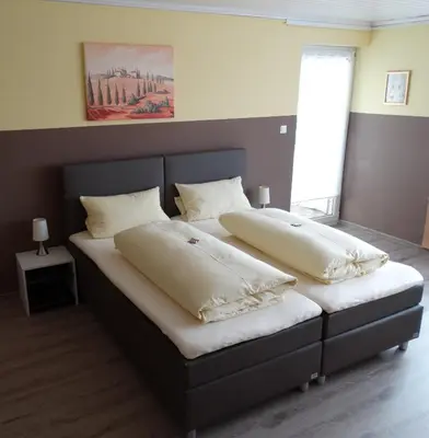 Ein Bett oder Betten in einem Zimmer der Unterkunft Pension Wolkenstein