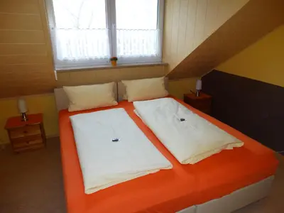 Ein Bett oder Betten in einem Zimmer der Unterkunft Pension Wolkenstein