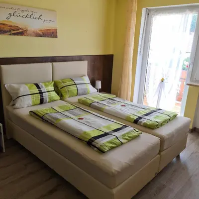 Ein Bett oder Betten in einem Zimmer der Unterkunft Pension Wolkenstein