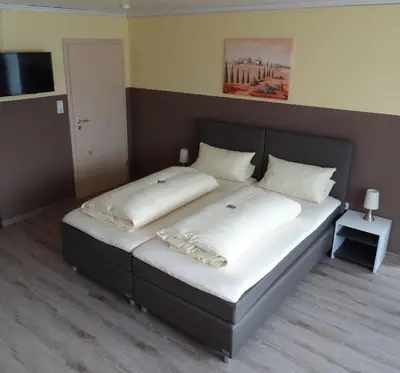 Ein Bett oder Betten in einem Zimmer der Unterkunft Pension Wolkenstein